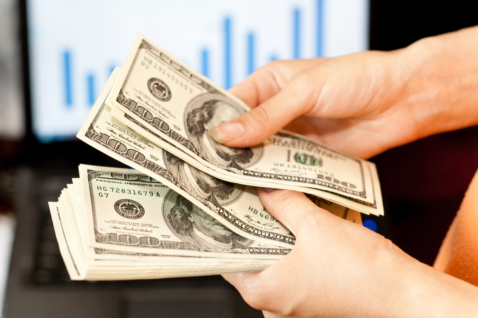 Handfuls of dollar bills- Visually impaired users please see our Accessibility Statement on the Terms Of Use page